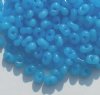 25 grams of 3x7mm Milky Blue Farfalle Seed Beads